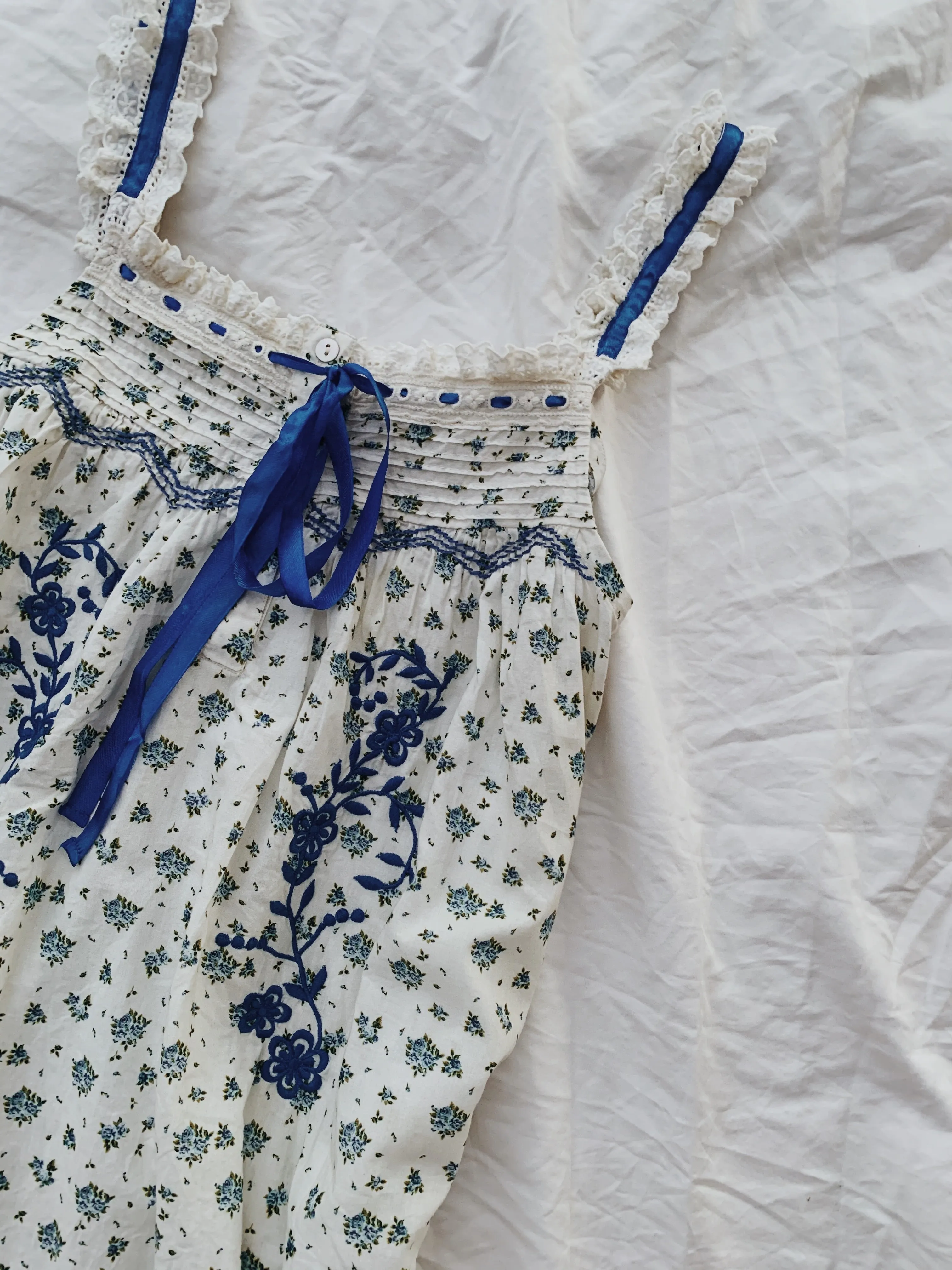 100% RECYCLED COTTON - NIGHTINGALE HAND SMOCKED MIDI DRESS BLUE ROSE FLORAL